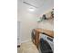 Laundry room with side-by-side washer and dryer, wood countertop, and storage at 1988 Clear Brooke Dr, Kannapolis, NC 28083