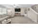 Comfortable living room features plush seating, soft carpeting, and a TV, perfect for relaxing and entertaining at 1988 Clear Brooke Dr, Kannapolis, NC 28083