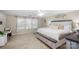 Serene main bedroom with a large bed, a cozy chaise lounge, and soft natural light for ultimate relaxation at 1988 Clear Brooke Dr, Kannapolis, NC 28083