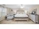 Bright main bedroom featuring a comfortable bed, chaise lounge, and dresser, creating a relaxing and inviting retreat at 1988 Clear Brooke Dr, Kannapolis, NC 28083