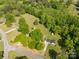Sprawling property with lush green trees and a charming home nestled in a serene, expansive landscape at 2007 Green Peach Rd, Lancaster, SC 29720