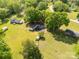 Aerial view of a property with lush green lawn, mature trees, a house, and an outbuilding at 2007 Green Peach Rd, Lancaster, SC 29720