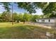Expansive backyard with lush green grass and a fenced-in patio area at 2007 Green Peach Rd, Lancaster, SC 29720