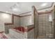 Bathroom showcasing tiled walls, a shower, and a bathtub at 2007 Green Peach Rd, Lancaster, SC 29720