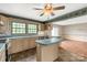 The kitchen features an island, stainless steel appliances, and lots of counter space for food prep at 2007 Green Peach Rd, Lancaster, SC 29720