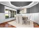 Elegant dining room with wainscoting, stylish chandelier, and large windows providing ample natural light at 202 Timber Lake Dr, Troutman, NC 28166