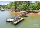 Beautiful lakeside home with a private dock and boat lift perfect for enjoying water activities and scenic views at 202 Timber Lake Dr, Troutman, NC 28166