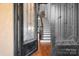 Elegant foyer with decorative glass doors, hardwood floors, and a staircase leading to the upper level at 202 Timber Lake Dr, Troutman, NC 28166