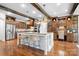 Gourmet kitchen with custom cabinetry, stainless steel appliances, and a large island with seating, perfect for entertaining at 202 Timber Lake Dr, Troutman, NC 28166