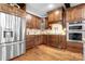 Well-equipped kitchen with custom wood cabinets, granite countertops, and stainless steel appliances, blending functionality and style at 202 Timber Lake Dr, Troutman, NC 28166