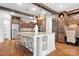 Spacious kitchen featuring a large island with seating, custom cabinetry, and modern appliances, ideal for culinary enthusiasts at 202 Timber Lake Dr, Troutman, NC 28166