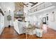 Bright living room with a stone fireplace, high ceilings, and an upper-level view, creating a grand and inviting space at 202 Timber Lake Dr, Troutman, NC 28166