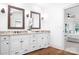 Elegant bathroom boasting dual vanities, granite countertops, and luxurious finishes for a spa-like experience at 202 Timber Lake Dr, Troutman, NC 28166