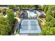 Aerial view of community amenities featuring tennis courts, swimming pool, and playground surrounded by lush trees at 204 Limerick Dr, Matthews, NC 28104