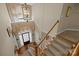 View of the foyer from above featuring a chandelier, hardwood floor, stairs, and a front door at 204 Limerick Dr, Matthews, NC 28104