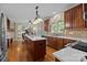 Open kitchen with stainless steel appliances, island and adjacent living room at 204 Limerick Dr, Matthews, NC 28104