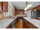Well-lit kitchen with stainless steel appliances and custom wood cabinets at 204 Limerick Dr, Matthews, NC 28104