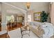 An open living room featuring hardwood floors, a decorative chandelier, and seating area at 204 Limerick Dr, Matthews, NC 28104