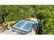 Aerial view of the tennis and pickle ball courts, with mature trees providing shade and residences in the background at 204 Limerick Dr, Matthews, NC 28104