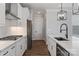 Bright kitchen with white cabinets, stainless steel appliances, and modern countertops at 2081 Fordhill St, Rock Hill, SC 29732