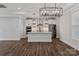 Beautiful kitchen with stainless steel appliances, island, white cabinets, and modern lighting at 2081 Fordhill St, Rock Hill, SC 29732