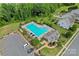 Aerial view of a community pool area with ample seating and nearby parking at 2124 Katie Alice Cir, Waxhaw, NC 28173