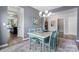 Cozy dining room featuring an aqua table and a modern chandelier at 2124 Katie Alice Cir, Waxhaw, NC 28173