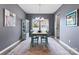 Traditional dining room with a chandelier, lovely rug and an open view to an adjacent room at 2124 Katie Alice Cir, Waxhaw, NC 28173