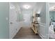 Inviting entryway with light blue walls, complemented by wood floors and tasteful decor at 2124 Katie Alice Cir, Waxhaw, NC 28173