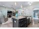 Open kitchen layout with stainless steel appliances and fireplace at 2124 Katie Alice Cir, Waxhaw, NC 28173