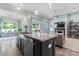 Open kitchen layout with stainless steel appliances, granite countertop and an island at 2124 Katie Alice Cir, Waxhaw, NC 28173