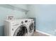 This laundry room features front-load washer and dryer units with a built in sink at 2124 Katie Alice Cir, Waxhaw, NC 28173
