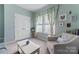 This living room offers 2 large windows, lots of lighting, and a comfy chair at 2124 Katie Alice Cir, Waxhaw, NC 28173