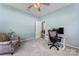Bright office space with ergonomic design and comfortable chair, overhead lighting, and neutral walls at 2124 Katie Alice Cir, Waxhaw, NC 28173