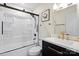 Modern bathroom with sleek vanity, updated fixtures, and shower with black-framed glass door at 232 Avery St, Fort Mill, SC 29715
