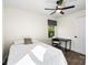 Bright bedroom features a ceiling fan, natural light, and a comfortable desk at 232 Avery St, Fort Mill, SC 29715