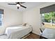 Comfortable bedroom with a ceiling fan, bright window, and functional desk area at 232 Avery St, Fort Mill, SC 29715