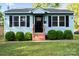 Charming home with light-blue siding, black shutters, and a well-maintained front yard at 232 Avery St, Fort Mill, SC 29715