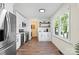Kitchen with stainless steel appliances, hardwood floors, white marble backsplash, and natural light at 232 Avery St, Fort Mill, SC 29715