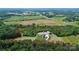 Expansive property showcasing the home's location surrounded by lush greenery and open fields at 25674 Old School Rd, Oakboro, NC 28129