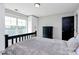 This primary bedroom features a large window and dark accent door at 25674 Old School Rd, Oakboro, NC 28129