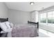 Cozy bedroom with dark furniture and a view outside the large window at 25674 Old School Rd, Oakboro, NC 28129