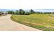 Lush grassy land near a road and a building, offering a glimpse of the natural surroundings and open space at 25674 Old School Rd, Oakboro, NC 28129
