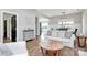 Open-concept living room with hardwood floors, with natural light and neutral decor at 25674 Old School Rd, Oakboro, NC 28129