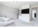 This living room offers a built in entertainment center and gray accent wall at 25674 Old School Rd, Oakboro, NC 28129