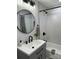 Bathroom with tiled shower and tub, black fixtures, and modern vanity at 300 Kelly St, Statesville, NC 28677