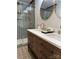 Elegant bathroom with double sinks, wood vanity, and a glass-enclosed shower at 300 Kelly St, Statesville, NC 28677