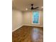 Bright bedroom with hardwood floors, ceiling fan, and natural light at 300 Kelly St, Statesville, NC 28677