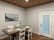 Cozy dining area with a farmhouse-style table and bright natural lighting at 300 Kelly St, Statesville, NC 28677