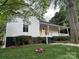 Beautiful home with a welcoming porch and well-maintained front yard landscaping at 300 Kelly St, Statesville, NC 28677